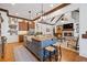 Open concept kitchen and living space, featuring modern appliances and a fireplace at 11660 Crabapple Rd, Roswell, GA 30075