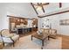 Open living space with high ceilings, exposed beams, and an adjacent kitchen at 11660 Crabapple Rd, Roswell, GA 30075