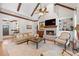 Bright living room with vaulted ceilings, fireplace, and comfortable seating at 11660 Crabapple Rd, Roswell, GA 30075