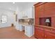 Office space features brick floors, built-in desk, and classic cabinetry at 11660 Crabapple Rd, Roswell, GA 30075