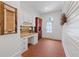 Office space featuring brick floors, built-in desk and cabinetry at 11660 Crabapple Rd, Roswell, GA 30075