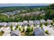 Wide aerial view of a neighborhood surrounded by lush greenery and varied housing options at 155 Marlow Dr, Woodstock, GA 30188