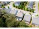 Aerial view of a residential area showcasing well-maintained homes with lush greenery and backyard patios at 155 Marlow Dr, Woodstock, GA 30188