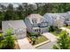 Aerial view of a meticulously landscaped two-story home, showcasing curb appeal and charm at 155 Marlow Dr, Woodstock, GA 30188