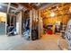 Unfinished basement with storage areas, visible insulation, exposed beams, and concrete floors at 155 Marlow Dr, Woodstock, GA 30188