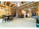 Unfinished basement with visible wood beams, utility and storage areas, and some furniture at 155 Marlow Dr, Woodstock, GA 30188
