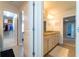 Bathroom with a double vanity, walk-in closet, and tile flooring at 155 Marlow Dr, Woodstock, GA 30188