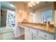 Bright bathroom has vanity with granite top, shower-tub combo, and cheerful butterfly decor at 155 Marlow Dr, Woodstock, GA 30188