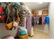 Well-organized closet offers generous storage space with racks and shelving for clothes and accessories at 155 Marlow Dr, Woodstock, GA 30188