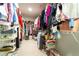 Spacious walk-in closet offers ample storage with hanging racks, shelves, and built-in organization at 155 Marlow Dr, Woodstock, GA 30188