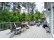 Relaxing outdoor deck featuring comfortable seating, dining area, and serene views of the surrounding greenery at 155 Marlow Dr, Woodstock, GA 30188