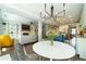 Cozy dining area with modern chandelier, kitchen views, and access to outdoor deck at 155 Marlow Dr, Woodstock, GA 30188
