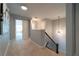 Upstairs landing with carpeted floors and stairway with iron railing at 155 Marlow Dr, Woodstock, GA 30188