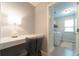 Office nook featuring built-in desk and view into a bright laundry room at 155 Marlow Dr, Woodstock, GA 30188
