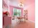 Pink home office with stylish gold accents and natural light at 155 Marlow Dr, Woodstock, GA 30188