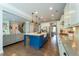 Well-lit kitchen with a large island, stainless steel appliances, and hardwood floors at 155 Marlow Dr, Woodstock, GA 30188