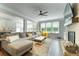 Bright living room features a large sectional, fireplace, and hardwood floors at 155 Marlow Dr, Woodstock, GA 30188