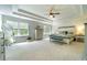 Spacious main bedroom featuring tray ceiling and lots of natural light at 155 Marlow Dr, Woodstock, GA 30188