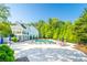 Resort-style community pool with lounge chairs, umbrellas, and clubhouse creating a relaxing retreat at 155 Marlow Dr, Woodstock, GA 30188