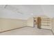 Attic room with carpet flooring, neutral paint, skylight, and access to additional storage or living space at 1559 Norwood Dr, Lilburn, GA 30047
