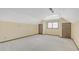 Spacious attic room with dormer windows, neutral paint, and carpet flooring at 1559 Norwood Dr, Lilburn, GA 30047