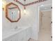 Bathroom featuring a vanity with mirror and a separate shower room with tile surround at 1559 Norwood Dr, Lilburn, GA 30047