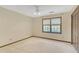 Bedroom featuring a window, ceiling fan, and closet at 1559 Norwood Dr, Lilburn, GA 30047
