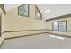 Spacious bedroom with high ceilings, large windows, and decorative wood trim at 1559 Norwood Dr, Lilburn, GA 30047