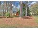 View of a house exterior showing a mix of natural beauty and peaceful living at 1559 Norwood Dr, Lilburn, GA 30047