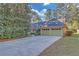 Charming home with a two-car garage, mature trees, and a long driveway at 1559 Norwood Dr, Lilburn, GA 30047