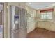 Bright kitchen with stainless steel appliances, granite countertops, and custom cabinetry at 1559 Norwood Dr, Lilburn, GA 30047