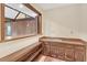 A rustic wet bar featuring shelving, storage, and a view to the main living room at 1559 Norwood Dr, Lilburn, GA 30047