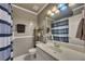 Bathroom with a single sink, tile floors, shower and tub at 529 Wintergreen Way, Canton, GA 30115