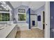 Bathroom featuring double sinks, a bathtub, and a glass-enclosed shower at 529 Wintergreen Way, Canton, GA 30115