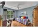 Bedroom featuring a comfortable bed, wood floors, and a bright atmosphere at 529 Wintergreen Way, Canton, GA 30115