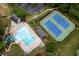 Aerial view of the community pool and tennis courts offering recreational opportunities for residents at 529 Wintergreen Way, Canton, GA 30115