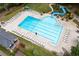 Expansive community pool area with a slide and plenty of lounge chairs for residents to enjoy at 529 Wintergreen Way, Canton, GA 30115
