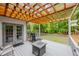 Outdoor deck with wood pergola, grill, and seating area perfect for relaxation and entertainment at 529 Wintergreen Way, Canton, GA 30115