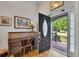 Elegant entryway featuring hardwood floors, an antique desk, and a view to the front porch at 529 Wintergreen Way, Canton, GA 30115