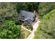 Charming home nestled in lush greenery with a well-manicured lawn and inviting curb appeal at 529 Wintergreen Way, Canton, GA 30115