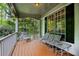Cozy front porch with furniture, offering a relaxing outdoor space with wooded view at 529 Wintergreen Way, Canton, GA 30115