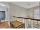 Upstairs hallway with hardwood floors and a vintage trunk adds character to the home at 529 Wintergreen Way, Canton, GA 30115