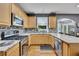 Well-appointed kitchen boasts stainless steel appliances and ample counter space for food preparation at 529 Wintergreen Way, Canton, GA 30115