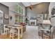 Spacious living room with a fireplace, tall windows, and lots of natural light at 529 Wintergreen Way, Canton, GA 30115