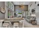 Spacious living room with a fireplace, tall windows, and lots of natural light at 529 Wintergreen Way, Canton, GA 30115