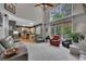 Spacious living room with a fireplace, tall windows, and lots of natural light at 529 Wintergreen Way, Canton, GA 30115