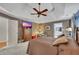 Spacious main bedroom featuring a TV, dresser, neutral tones, and en-suite bathroom at 529 Wintergreen Way, Canton, GA 30115