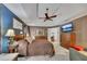 Large main bedroom with comfortable furnishings, a ceiling fan, and light gray carpet at 529 Wintergreen Way, Canton, GA 30115