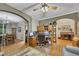 Bright office space with hardwood flooring, built-in shelving, and a ceiling fan at 529 Wintergreen Way, Canton, GA 30115