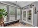 Charming sunroom with tiled floors, windows, and access to the backyard at 529 Wintergreen Way, Canton, GA 30115